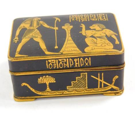 An early 20thC Egyptian brass and niello snuff box, decorated with ancient Egyptian figures, Gods, symbols and Hieroglyphs, 4.5cm W.