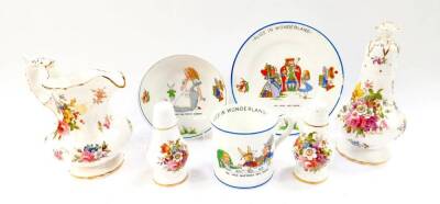 A Hammersley porcelain Alice in Wonderland child's breakfast set, comprising cereal bowl, plate and mug, together with a Hammersley milk jug, sugar sifter, salt and pepper, decorated with floral sprays. (7)
