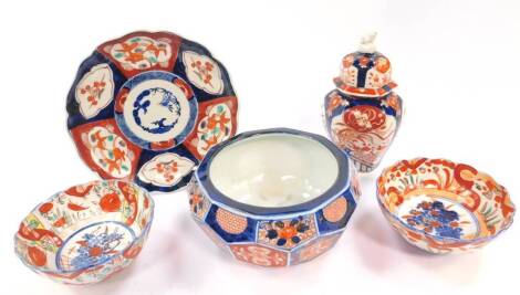 A group of Chinese imari porcelain, panel decorated with Buddhistic symbols, flowers, birds and fish, comprising an hexagonal jar and cover, faceted bowl, fluted dish and two smaller fluted bowls. (5)