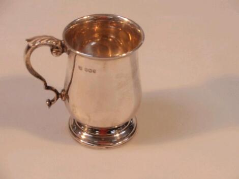 An Elizabeth II silver mug of baluster form