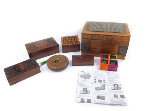 An Eastern hardwood and metal bound and panelled box, 16cm H, 28cm W, 19cm D, three Indian hardwood and brass inlaid graduated boxes, 20.5cm x 12.5cm, 17cm x 9.5cm, and 13.5cm x 5.5cm, together with a wooden cased game of Cube World, and a Rabone leather 