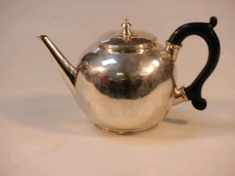 A late Victorian bullet shaped Irish silver teapot