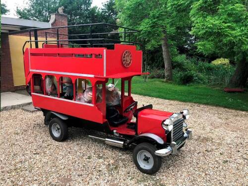 A half scale open top showcase double decker bus, c1983, with automata clock, and fully animated magic roundabout figures, the coach having a Triumph Marina petrol engine, automata with music and lights timed to half hour performance, together with mounte