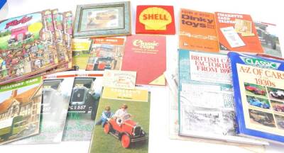 A plastic Shell advertising panel, 14cm Sq, and assorted automotive and other books.