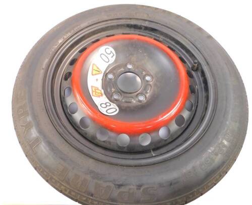 A Spacesaver spare wheel for a Jaguar S Type.