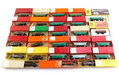 Various EKO and other N gauge rolling stock, etc, railway accessories, rolling stock, etc, coal trucks, wagons Guterwagen, etc, all boxed. (qty)