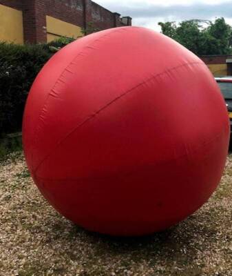 A large inflatable activity ball, 'Push-A-Ball', for outdoor team games.