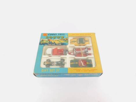 A Corgi die cast Lotus Racing Team, Gift Set 37, boxed, comprising a Lotus Climax Racing Car, Lotus Elan Coupe, Lotus Elan S.2., Volkswagen Breakdown with winch, Lotus Elan Chassis on tailer and accessories.