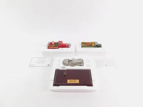 A Matchbox pewter model of a Jaguar SS100, with stand, together with Santa's 1997 Fire Engine, and a 1932 Mercedes Benz L5 lorry, special edition, both with certificates. (3)