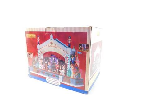 A Lemax Village Collection Nutcracker Suite, set of seven, boxed, together with two plastic Winter tableau bases, and Lemax cables. (4)