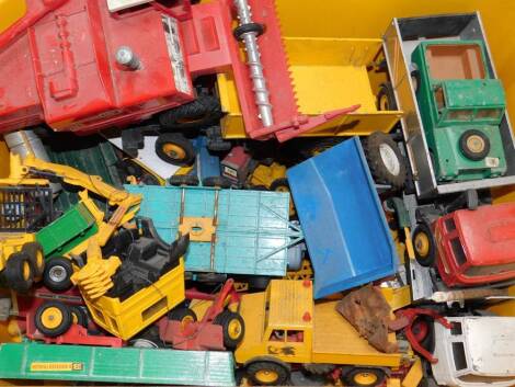 Britains farmyard vehicles and machinery, including a Massey Ferguson combine harvester, 8 wheeled trailer, Autoway crane, rowler, trucks, etc., play worn. (qty)