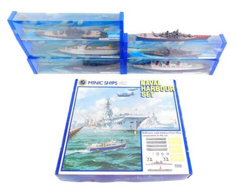 A Minic Ships Naval Harbour Set, scale 1:1200, die cast by Hornby, together with three battleships, comprising the K M Bismarck M742., K M Scharnhorst M745., IJN Yamato M744., and two cruise liners, comprising RMS Queen Mary M703., and RMS Canberra M715, 