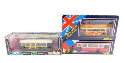 Three Solido die cast buses, comprising London Double Decker, advertising Crosse & Blackwell Soups., Renault Bus TN6C, green body with advert for Banania, and another red body advertising Griaudy, all boxed.