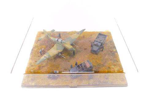 A WWII German Model Aircraft Tableau, showing a Messerschmitt BF109, RAF staff car and personnel, truck and motorcycle with side rider, perspex cased, 34.5cm x 43cm.