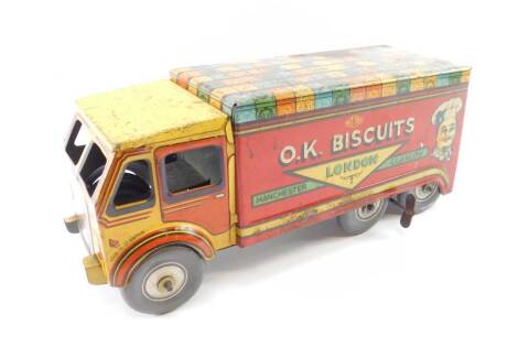 A Mettoy tin plate clockwork lorry, advertising OK Biscuits, London Manchester and Glasgow, with key.