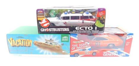 A Joyride die cst model of The Ghostbuster's Ecto I, National Lampoon's Vacation Wagon Queen "Family Truckster", and an American Muscle The Dukes Of Hazard 1969 Charger General Lee, all boxed. (3)