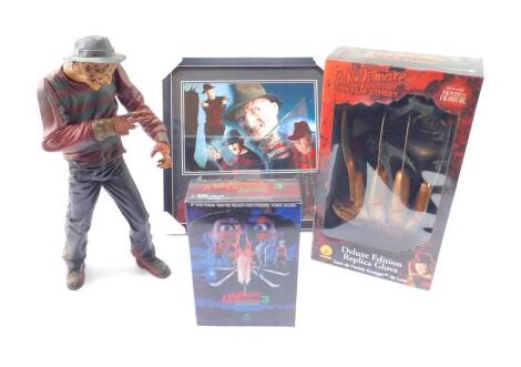 A Rubies House Of Horror Deluxe Edition replica glove, Freddy Krueger, A Nightmare On Elm Street, Dream Warriors Figural Set A Nightmare On Elm Street III, further figure of Freddy Krueger and a print from the film. (4)