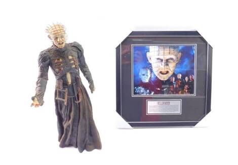 A 2003 Miramax Promotions Hellraiser figure, 47cm H, together with a print of Hellraiser characters. (2)