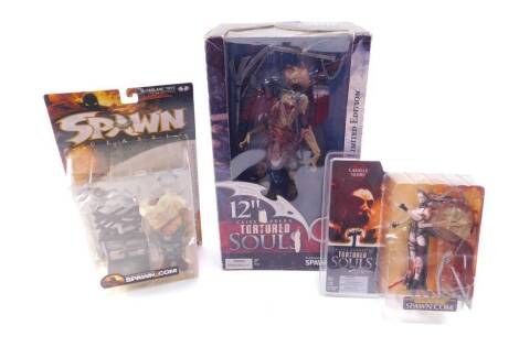 A MacFarlane Model from Clive Barker's Tortured Souls, Spawn.com, limited edition, 12" H, and two further figures modelled as Camille Noire, and Clown III, all boxed. (3)