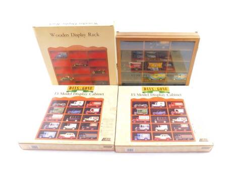 Three Lledo Days Gone By model display cabinets, boxed, and an unboxed display cabinet containing four die cast vehicles and a 00 gauge wagon. (qty)