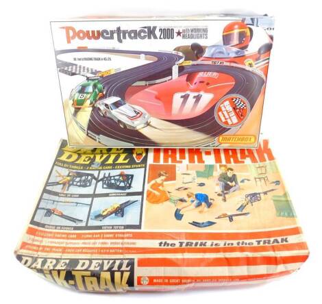 A Transogram Daredevil Trik-Trak, Power Track 2000, and a Hot Wheels Stunt Action Set, all boxed. (3)