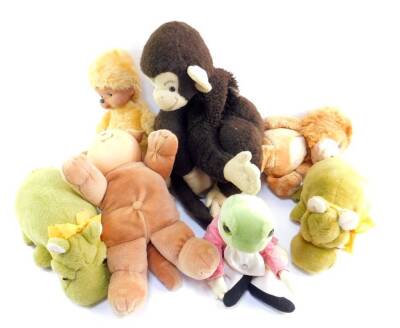 A Pedigree Lester Lion, Merrythought green hippopotamuses, Eden Jeremy Fisher, Merrythought Monkey, and two Cabbage Patch dolls.