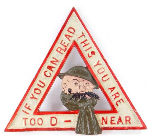 A triangular warning badge, marked 'If you can read this you are too D-near', and centred with the bust of Old Bill by Bruce Bairnsfather, 15cm wide. 