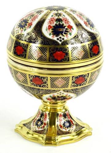 The Royal Crown Derby Millenium clock, decorated in Imari pattern, the hinged lid enclosing a clock, marked with the compass points to each corner and the interior of the lid inscribed with a saying from ecclesiastes 3 (King James version), limited editio