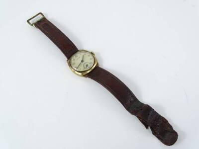 A 9ct gold Vertex gent's wristwatch, with circular dial, in square case, with seconds dials, on a brown leather strap, 27.2g all in. - 2