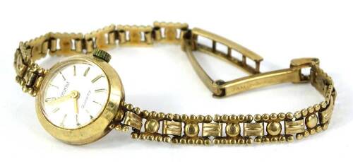 A 9ct gold Accurist ladies wristwatch, with circular watch head, and silvered dial, on a three row modern design bracelet, 11.5g all in.