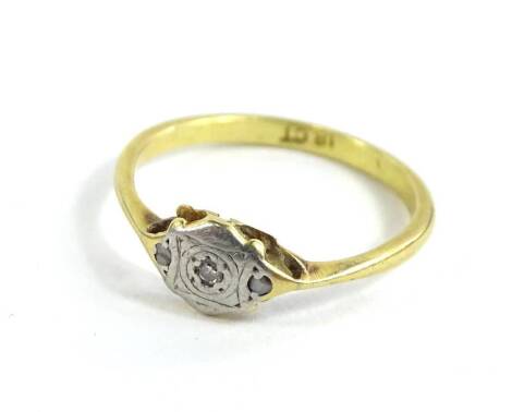 An 18ct gold and platinum dress ring, set with tiny diamonds, ring size O½, 2.2g all in.