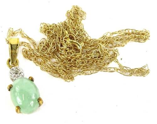 A 9ct gold jade and diamond necklace, the pendant set with oval jade in claw settings, with illusion set tiny diamond to top, on fine link chain, 1.6g all in.