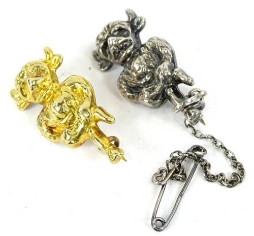 Two Imp brooches, to include a silver imp brooch, with safety chain, 2.5cm high, a 9ct gold imp brooch, 3cm high, 1.3g. (2)