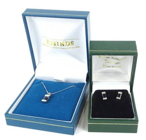 A sapphire and diamond earring and necklace set, the pendant with rectangular cut sapphire and two pave set tiny diamonds to each end, white metal, unmarked pendant, on fine link chain, marked 375, 2.1g all in, and a pair of associated earrings, marked 37