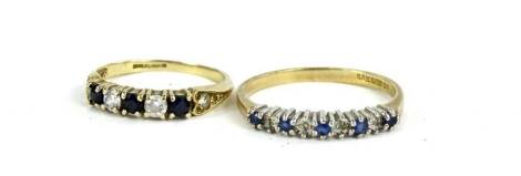 Two 9ct gold dress rings, comprising a half hoop eternity ring, set with blue and white stones and another set with five stones and heart shaped shoulders, 3.2g all in.