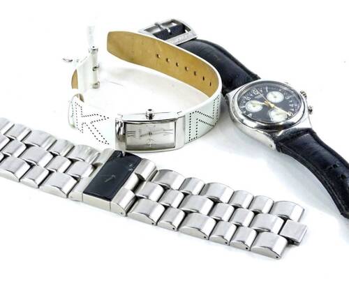 Three dress watches, to include a Storm three row stainless steel gent's wristwatch, a DKNY ladies wristwatch with white strap and square dial (both boxed) and a loose Swatch Swiss chronograph watch (3)