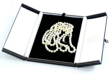 A cultured pearl necklace, each cultured pearl approximately 0.4mm wide, and designed with three gold interchangeable balls, creating different lengths, approx. 133cm L overall, each ball yellow metal stamped 585, boxed.