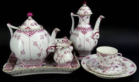 A collection of floral and scale decorated Royal Copenhagen porcelain, to include teapot and cover, hot water jug and cover, milk jug, tray, sugar bowl and trio.