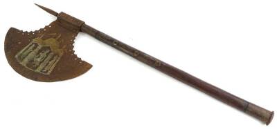 An iron and hardwood axe, decorated to the iron blade with figures within a tent etc., and stylised Arabic type writing, the handle embellished with brass roundel's and with an iron end, 77cm L.