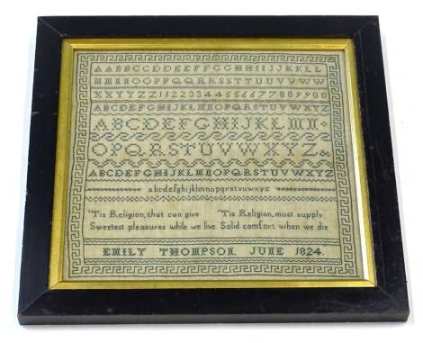 An early 19thC embroidered sampler, stitched with a religious motto, sample alphabet by Emily Thompson June 1824, in ebonised frame, 41cm x 40cm overall. Provenance: The property of Joan Stephenson, Kirkwood, North Church Walk, Newark, Nottinghamshire.