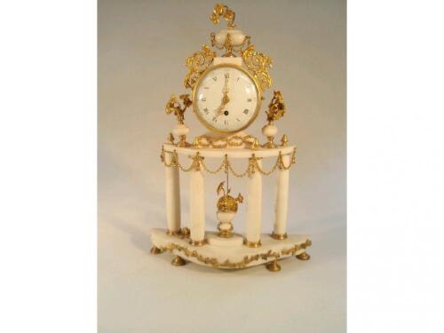 A 19thC French gilt and white marble mantel clock