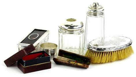 A collection of small silver etc., to include glass dressing table items with silver mounts, yellow metal napkin ring stamped silver etc.