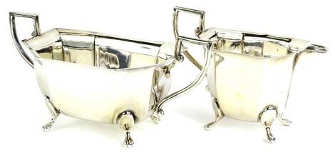 A George VI silver two handled sugar bowl, of canted rectangular form and a matching milk jug, Sheffield 1927, 11¾oz