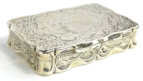 A Victorian silver rectangular snuff box, engraved with scrolls, the cartouche engraved "presented to J Graham etc. 1878", Birmingham 1878, 1¾oz.