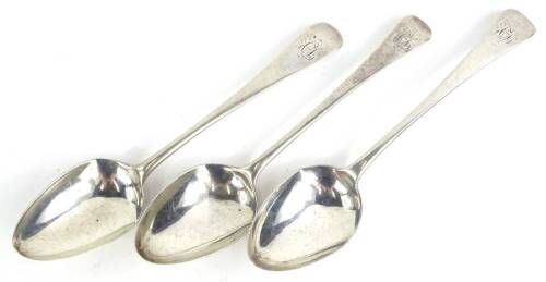 Three associated 19thC silver Old English pattern serving spoons, each engraved with a monogram, 5½oz.