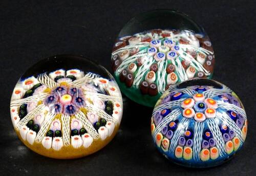 Three various Millefiore paperweights, each with stylised star decoration, unsigned.