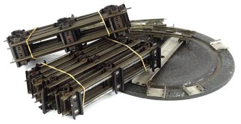 A large quantity of o'gauge tin plate track and turn table.