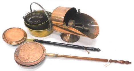 A collection of metalware, to include a copper coal scuttle with shovel, brass preserving pans, and two bed warmers with turned wood handles etc. Provenance: The property of Joan Stephenson, Kirkwood, North Church Walk, Newark, Nottinghamshire.