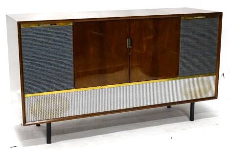 A Decca walnut cased radiogram, with turn table, radio receiver, integral speakers etc., 137cm W.