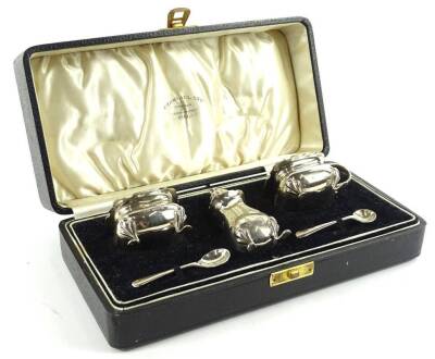 A cased George VI silver cruet set by the Aidy Brothers, comprising salt, mustard pot, pepper pot and two spoons, Birmingham 1937, the spoons 1936, in fitted case, 4½oz.